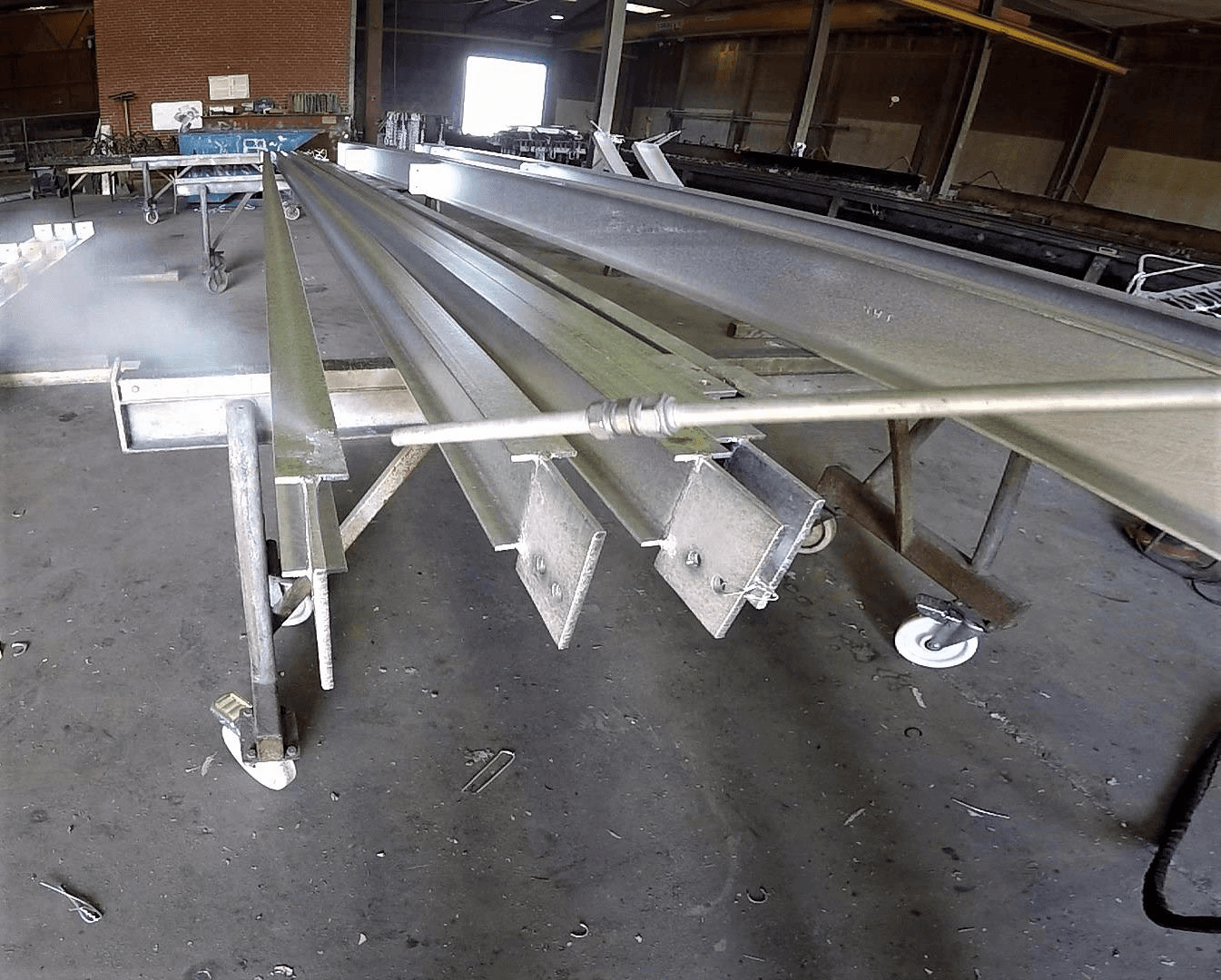 Hooks and hangers being cleaned near the galvanizing kettle